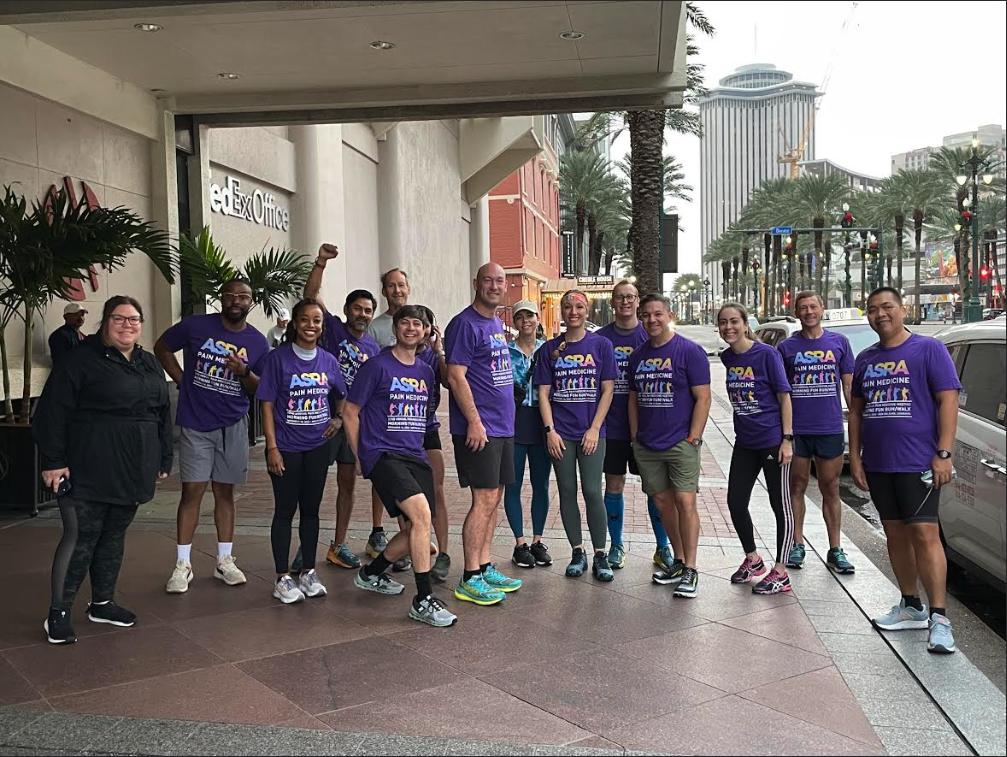 Group of people on the street with purple shirts