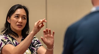 Dr. sharing ideas and talking with hands