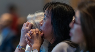 Attendees listening intently to a speaker