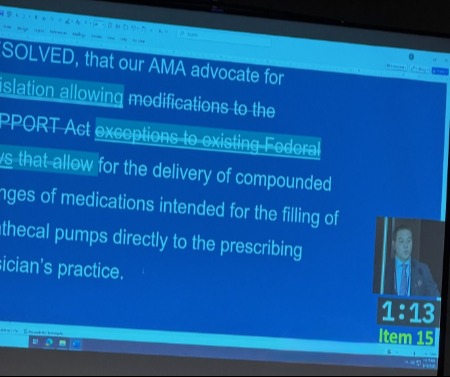 Picture of a screen showing resolution text with testimony being provided by Dr. Gary Schwartz