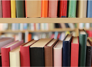 Bookshelf of colorful hardcover books