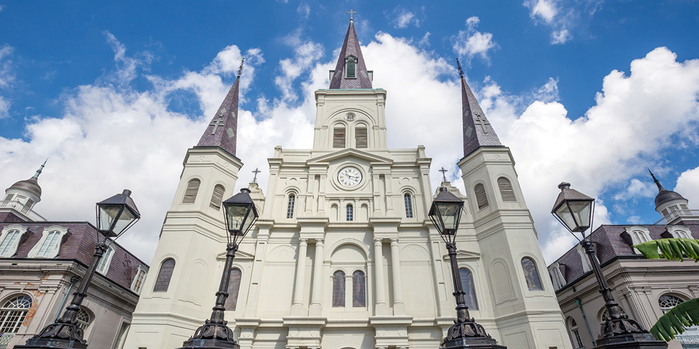 Color photo of St. Louis Cathedral in New Orleans, LA, with blue sky